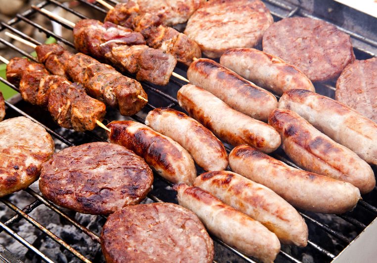 sausages, burgers and kebabs on bbq